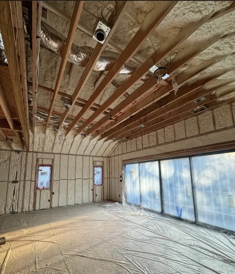 Interior walls and ceiling insulated with spray foam during new construction in Quincy